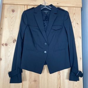 Never been worn unique and versatile navy blazer with sleeve buckle details.